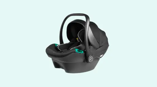 An infant car seat displayed in a monochrome color scheme of black and white.