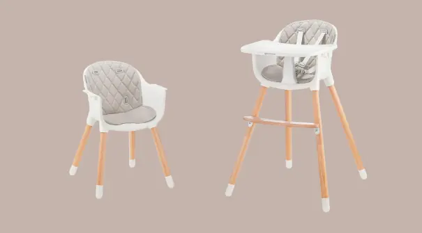  A sweet baby's room adorned with pink walls and stylish wooden furniture, ideal for nurturing and play.